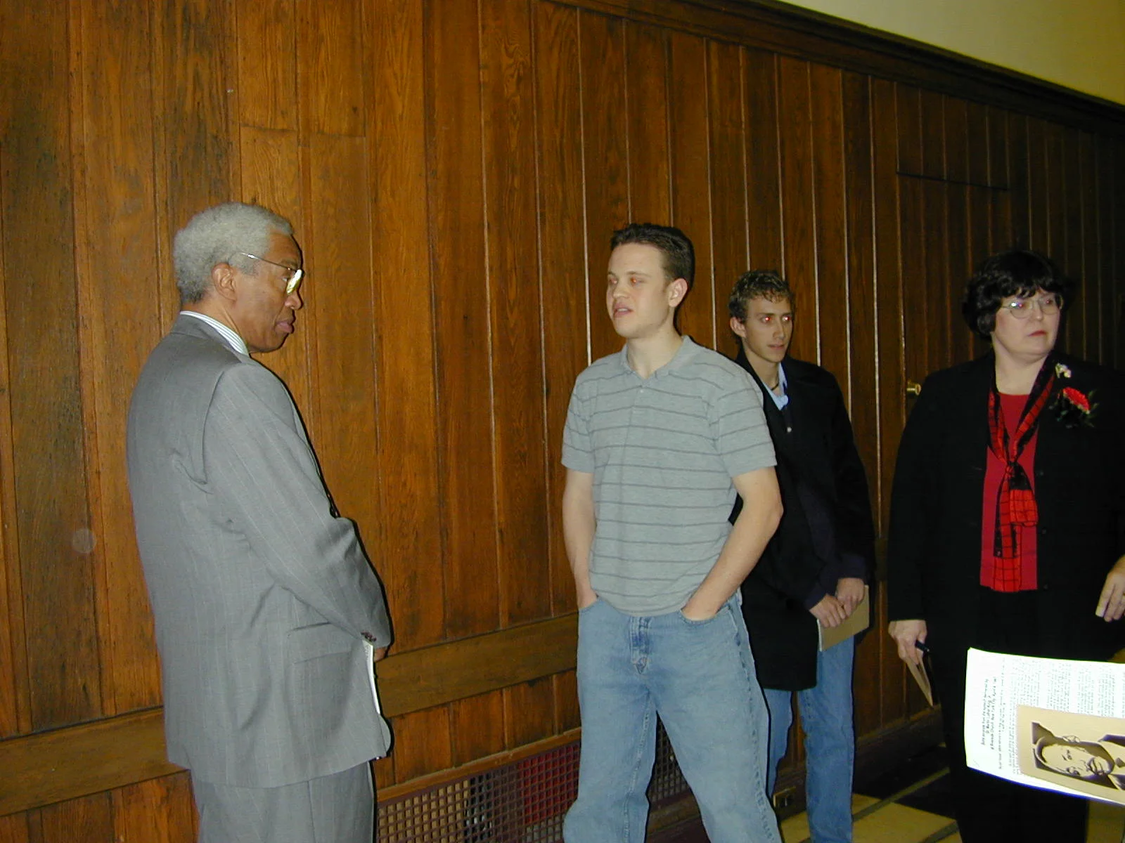 An engineering student speaks with Dr. Bluford. 