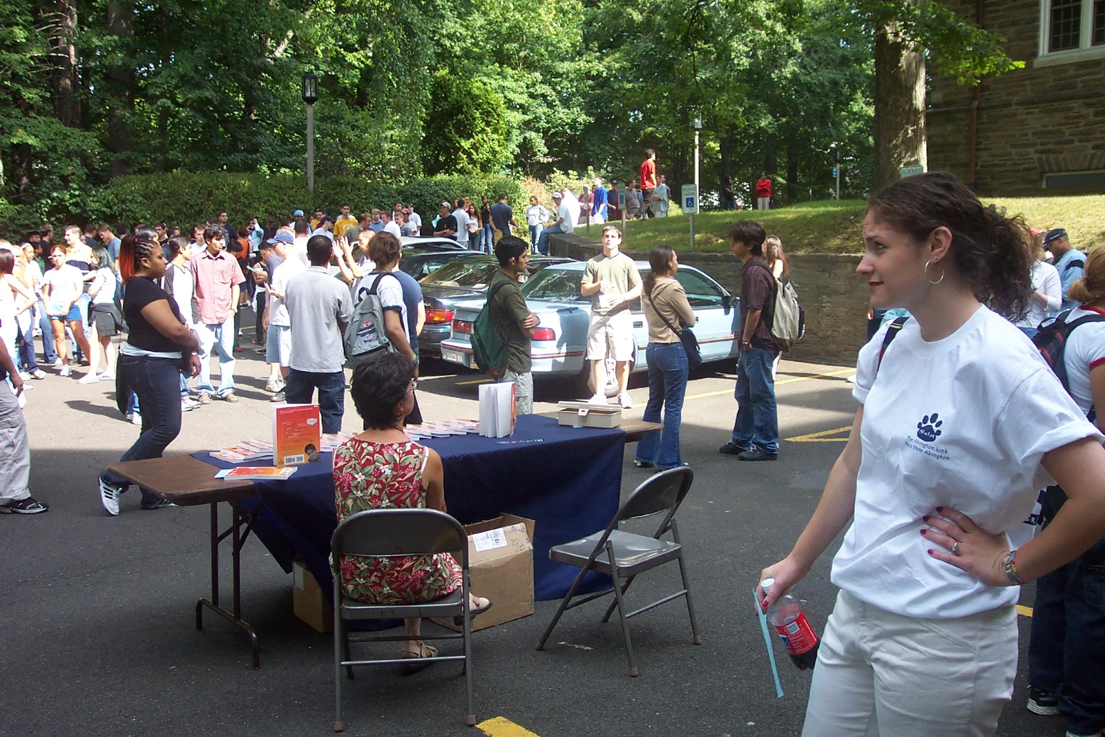 Here, Ashley looks exasperated while the freshmen mill around.