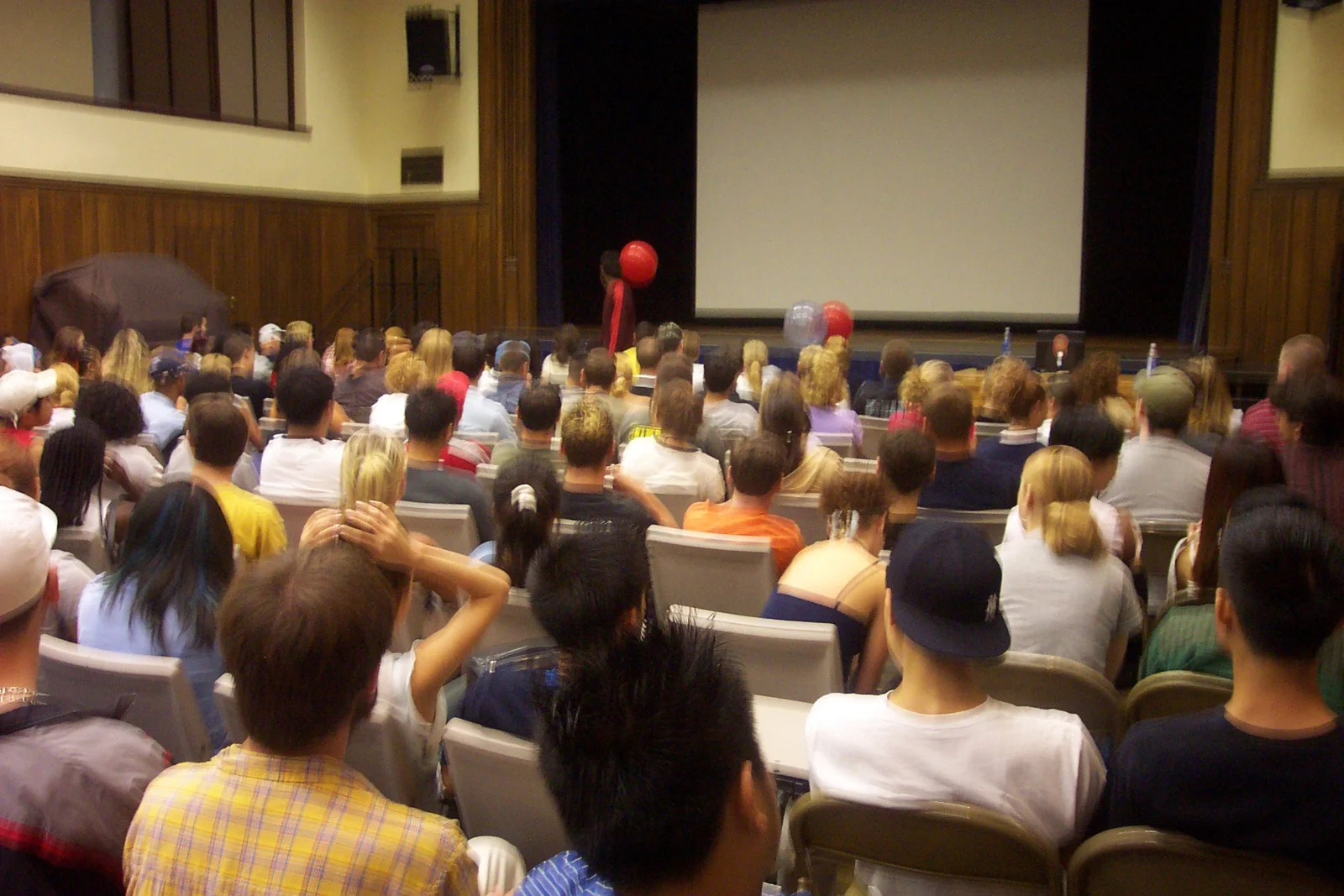 The crowd bounced rubber balls around while waiting for Patrick Combs to start speaking.