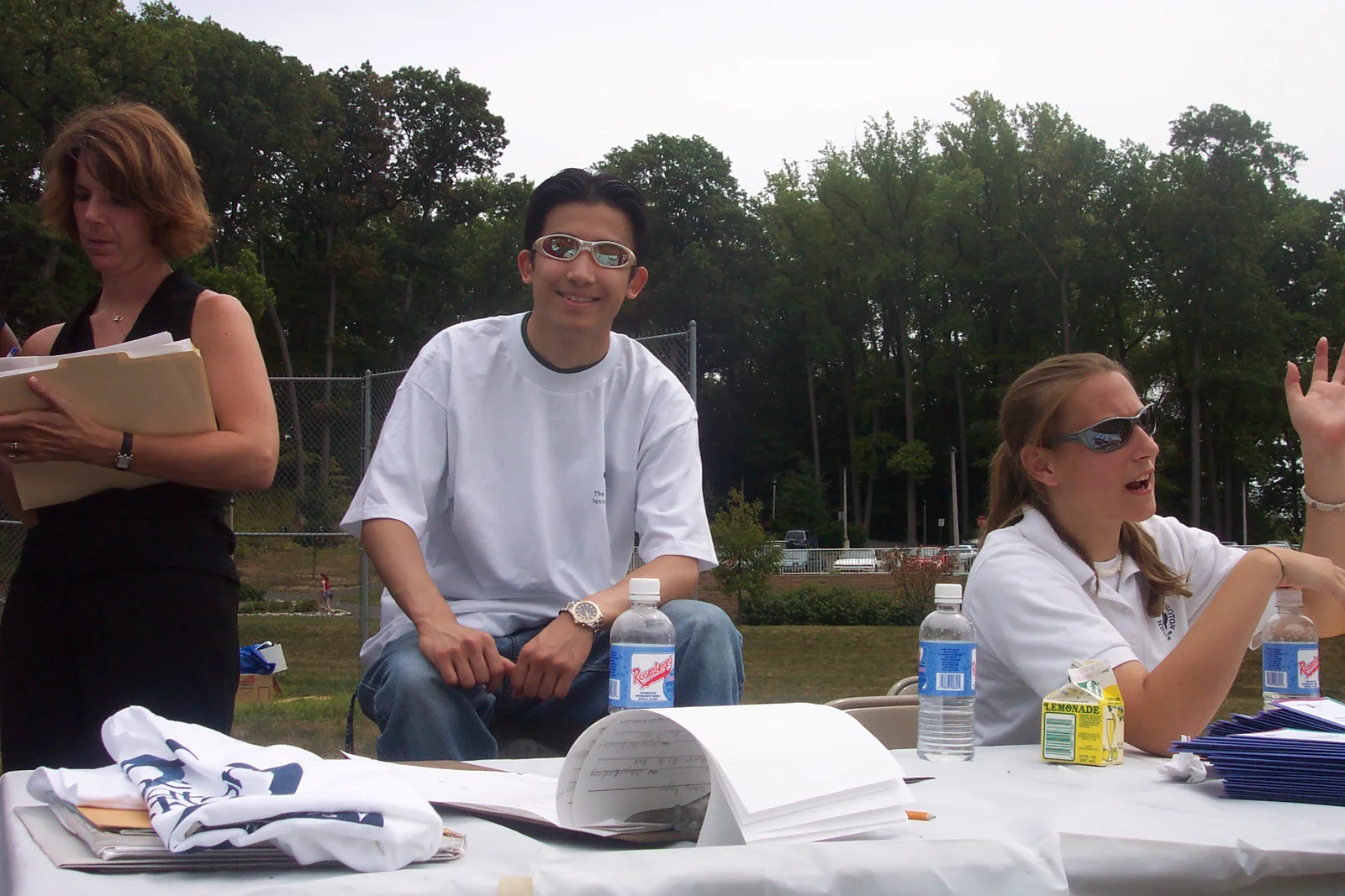 Calvin Tan represents an organization in the club involvement fair.
