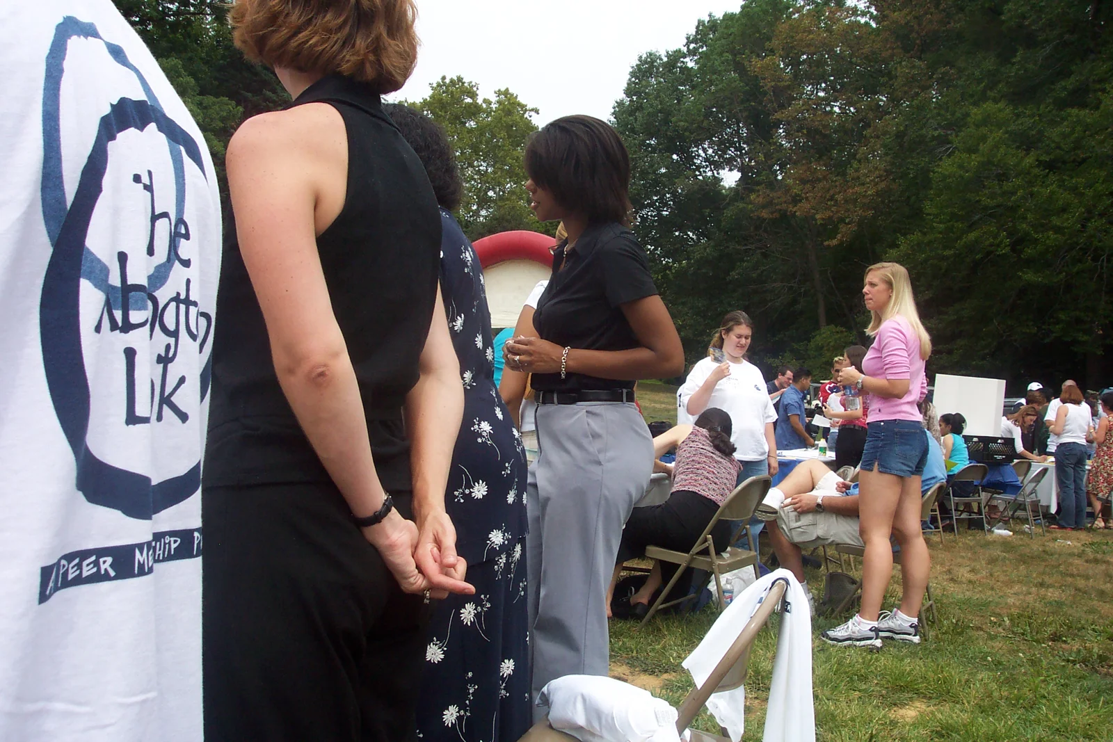 Stephanie Gillis, Latanya Moore, and a peer mentor talk to freshmen who would like to request a mentor.