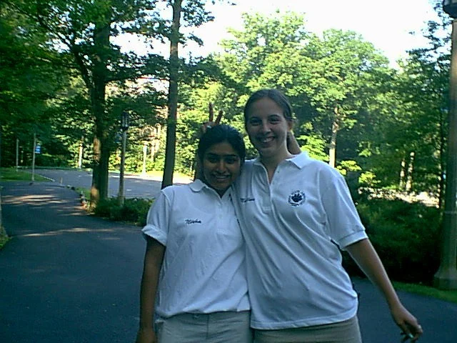 Matilda Clipner and Nisha walk out to the parking lot at the beginning of the day.