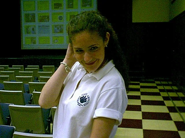 Ashley Martin grins at the camera. 