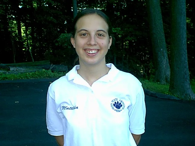Matilda Clipner, who was to graduate the next year, posed again for the SURVIVOR-style slideshow that was produced for the July 19 orientation.