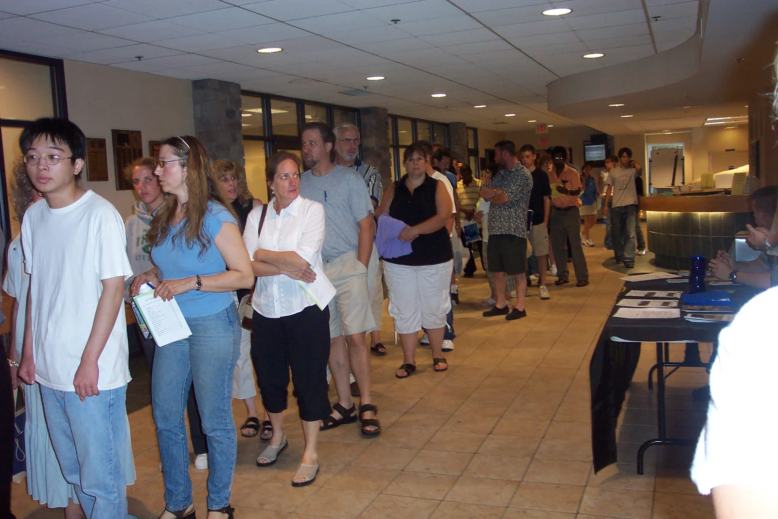 Parents line up for lunch at the cafeteria. 