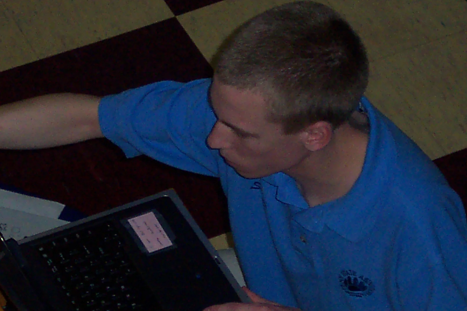 Steve Sokolowski operates the computer to display the score on the game board.