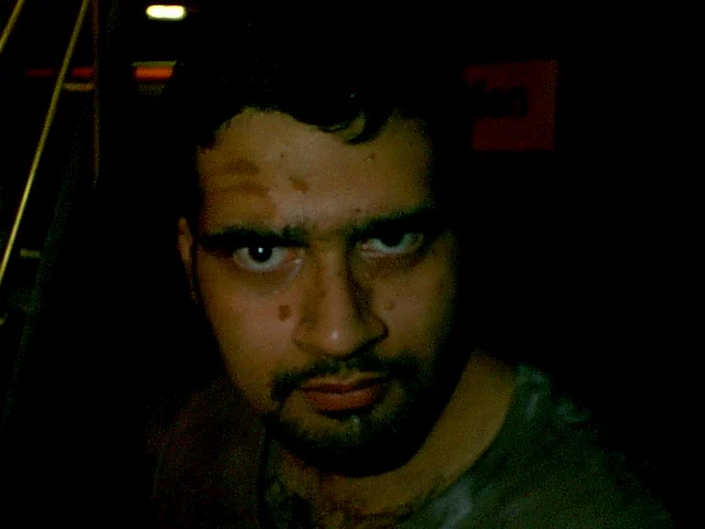 Shiraz Kahn hides in the shadows. 