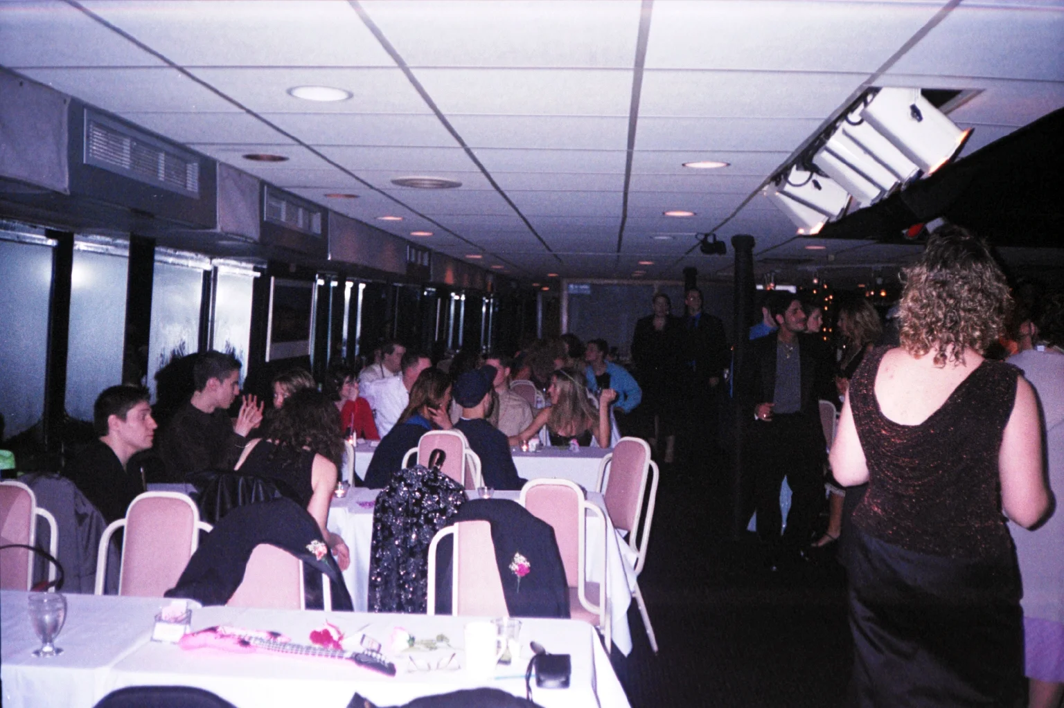 Rows of tables lined the windows on both sides of the dance floor.