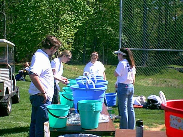 Kristina Amodei, LUB President, leads a team that sets up the tie dye booth. 