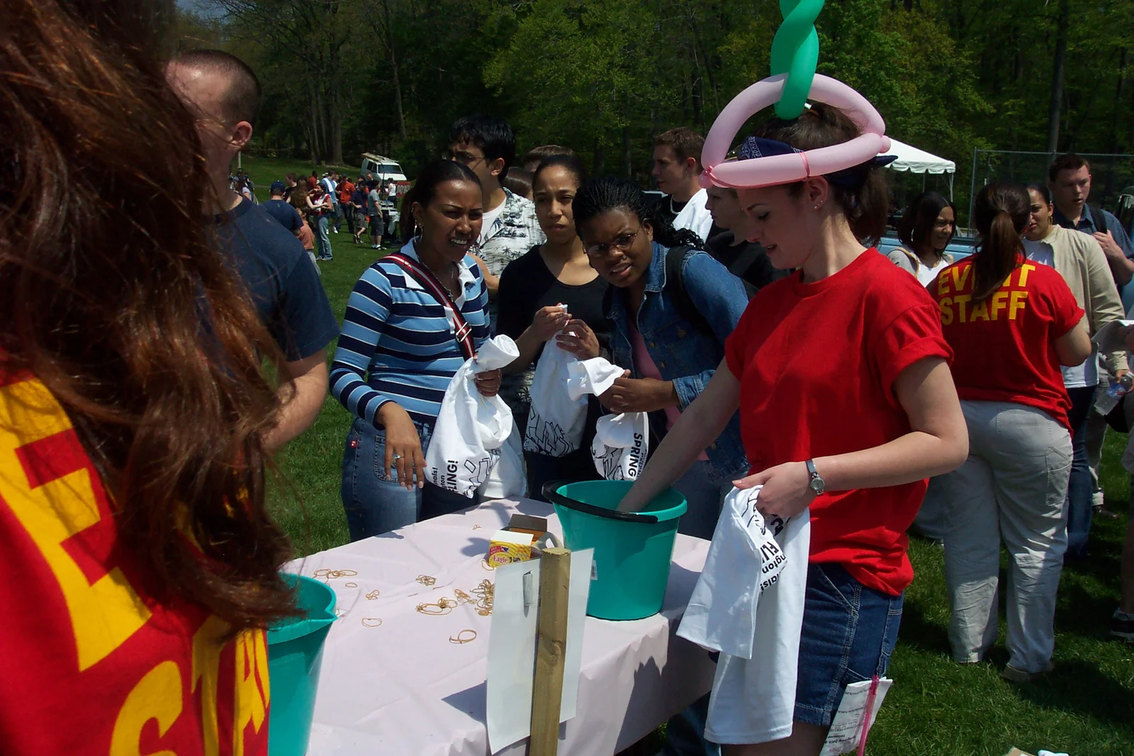 SGA President-elect Ashley Martin assists with tying a shirt. 