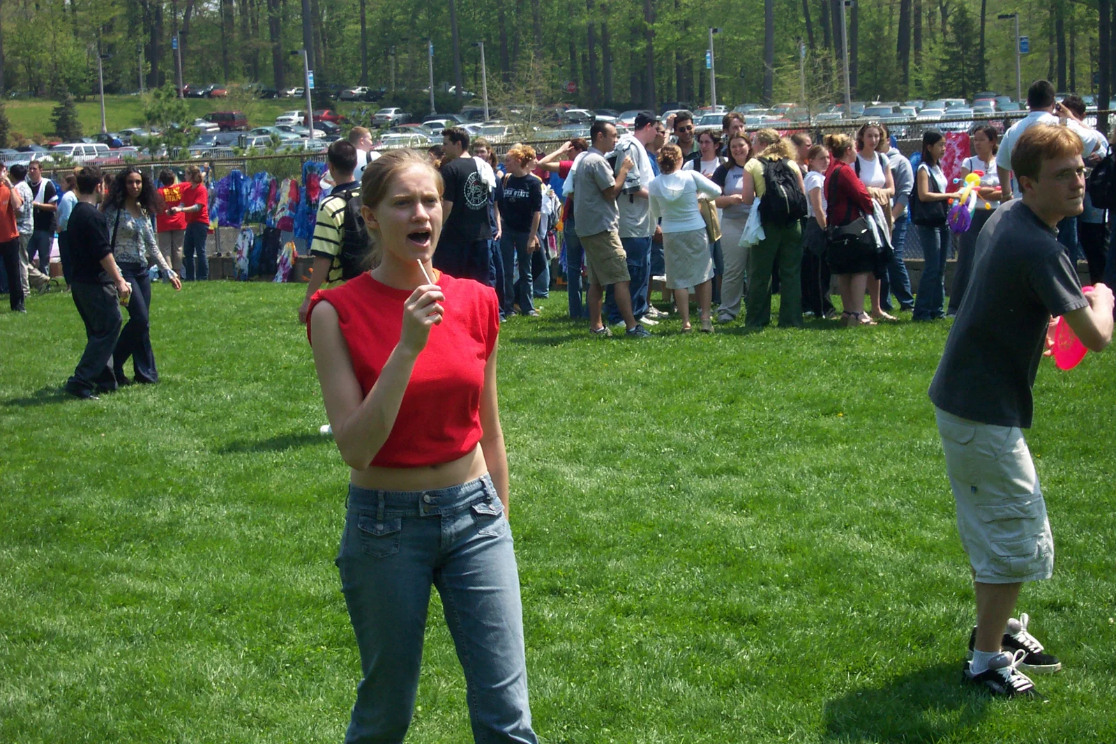 Corinne Shabe holds a lollipop as she shouts at someone behind the camera. 