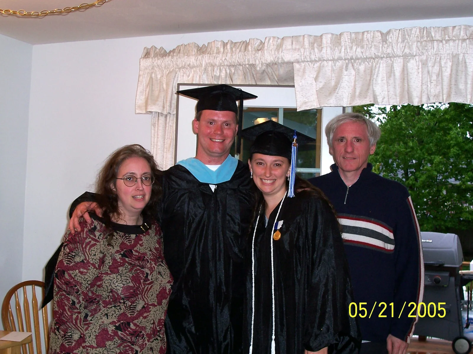 Sarah, Eric, and Sarah's parents. 