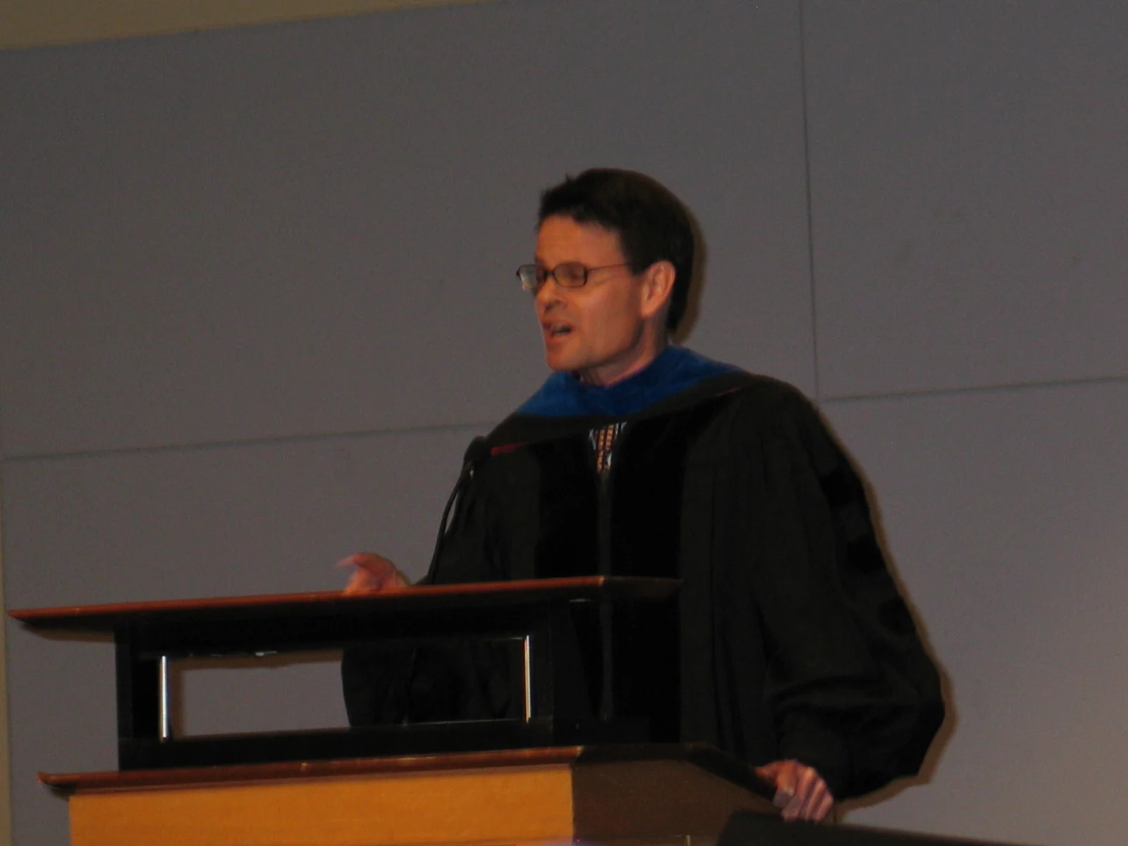 Clay Calvert, acting as interim president, was charged with joking about the meaning of popular rock groups' names.