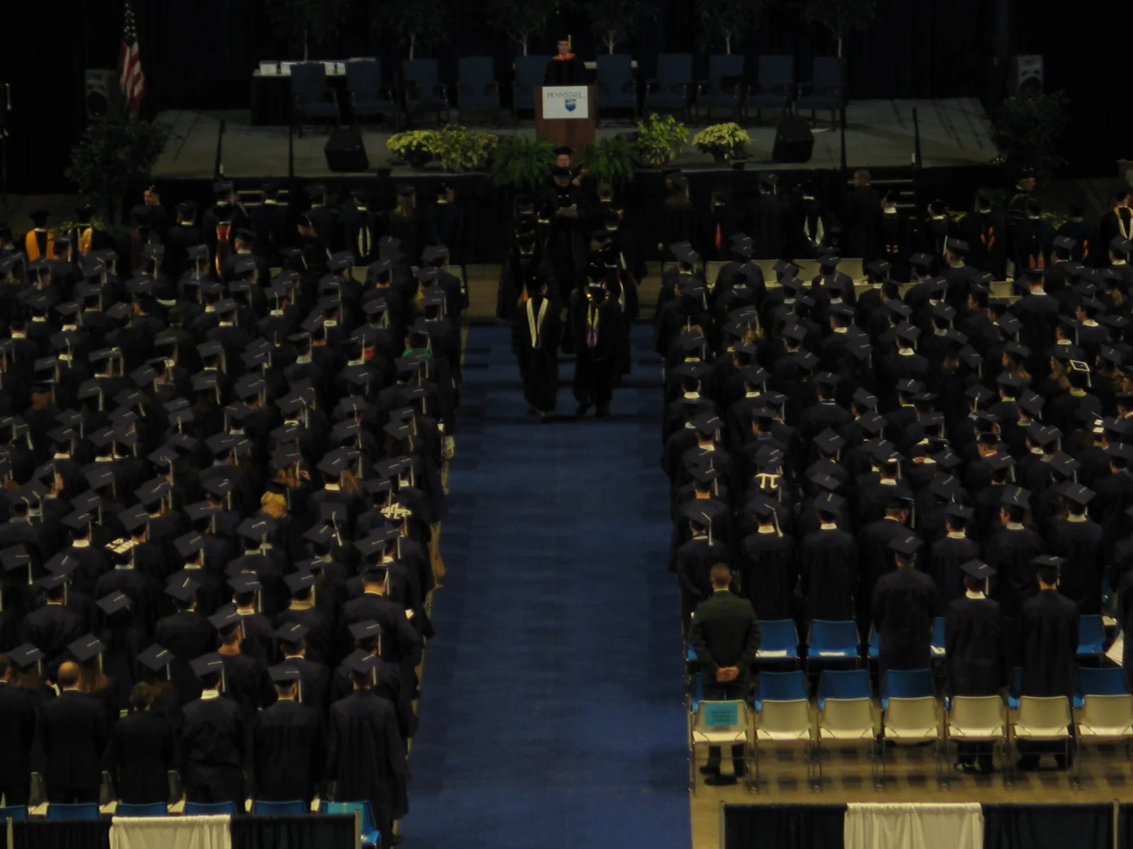 The wooden pole held by the first faculty member in the procession was salvaged from the first Old Main and has been used in the 331 previous commencement ceremonies. 