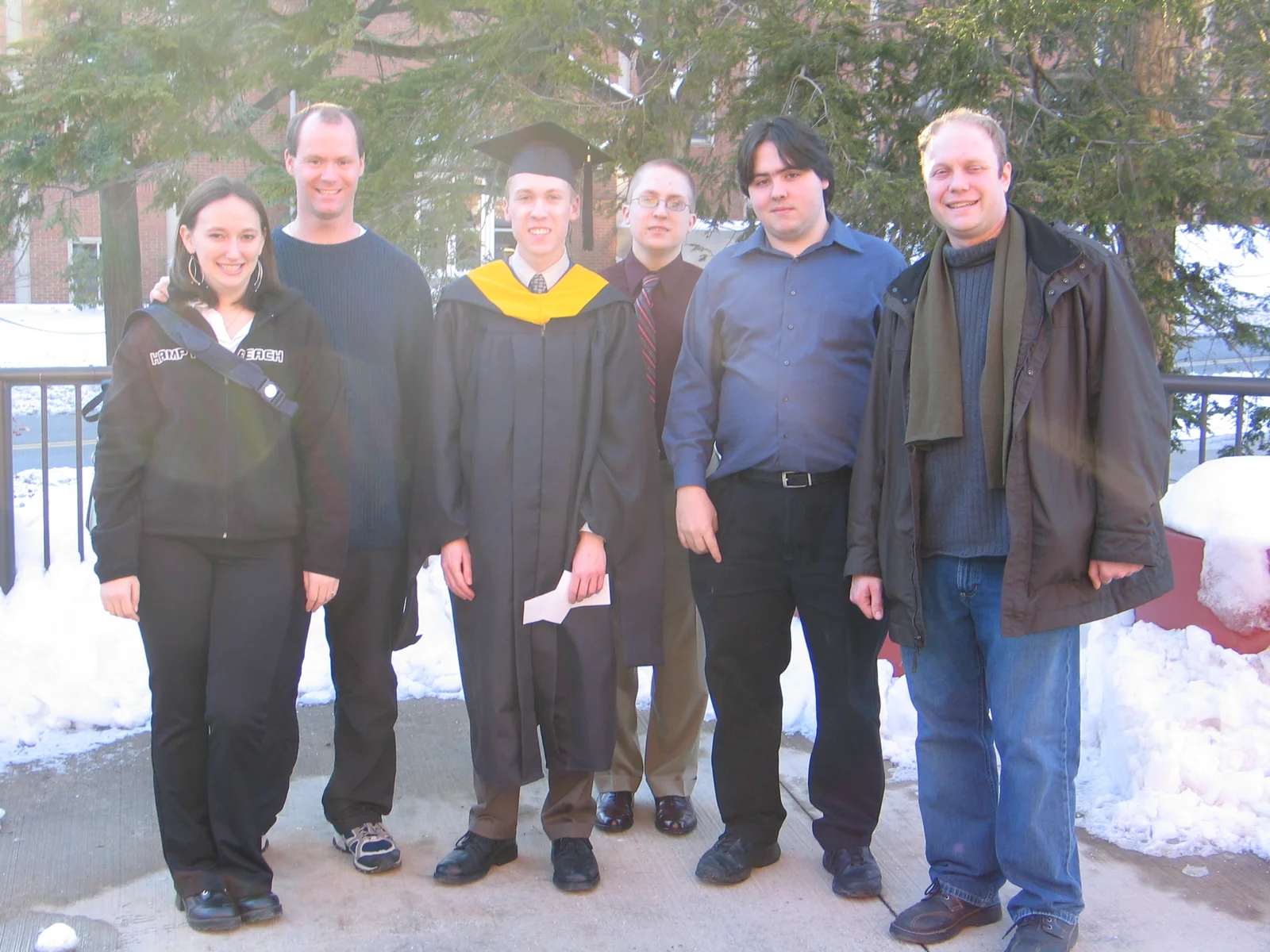 From left to right, Sarah, Eric, Steve, Christopher, John, and Gary stood in the 20-degree weather before the graduate degrees' ceremony. 