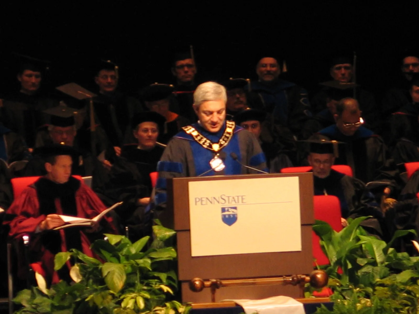 Dr. Spanier, wearing the symbol of his office, provides the opening remarks of the graduate commencement ceremonies.