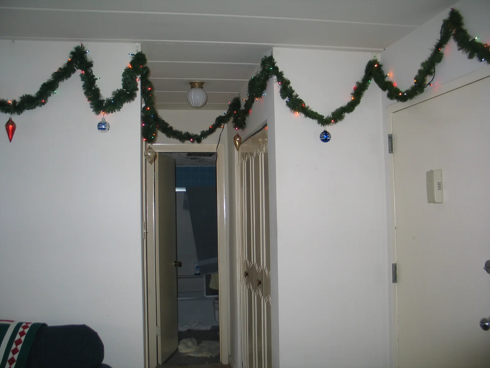This hall leads to the bathroom and the bedroom.