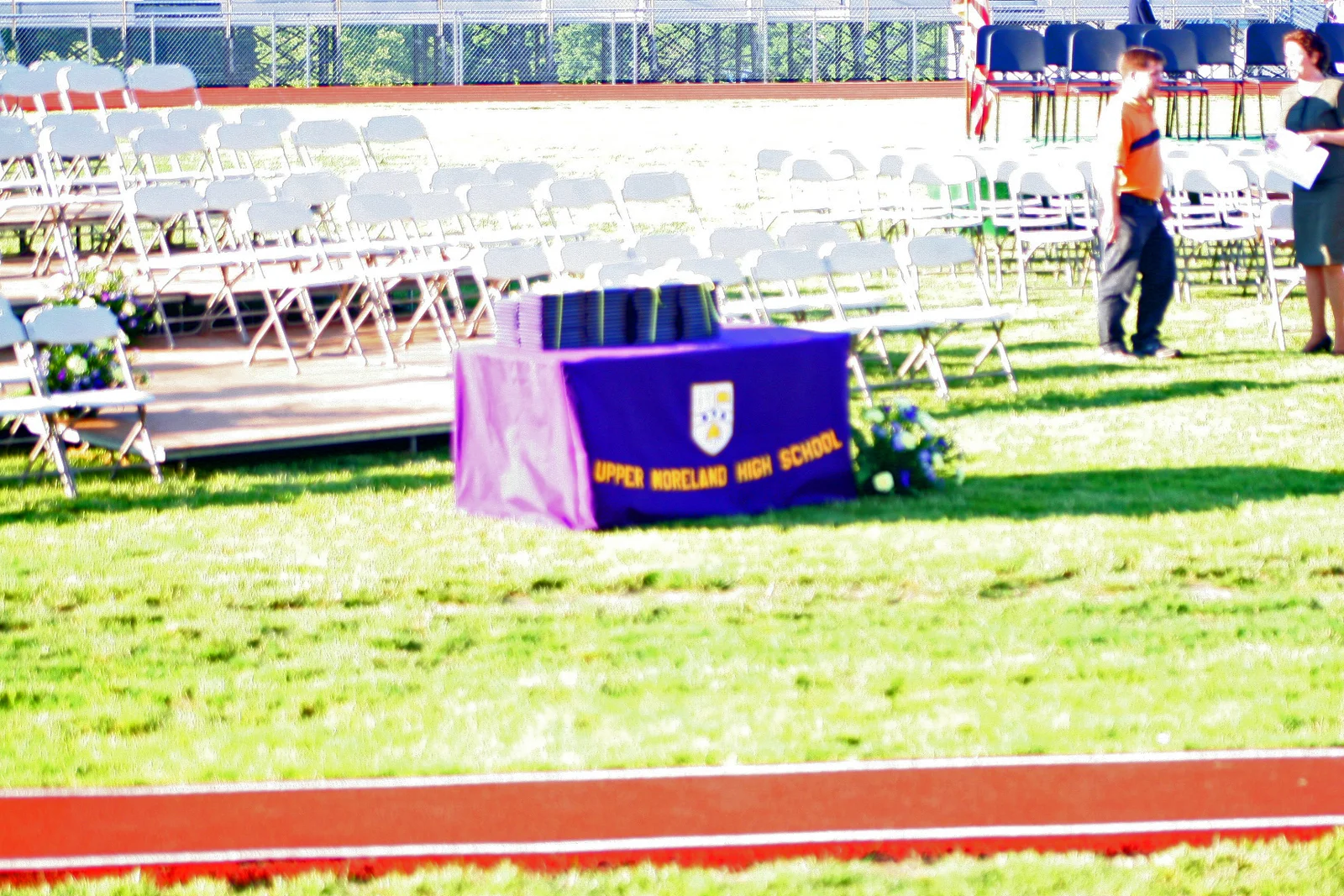 On this table would later rest the diplomas offered to the graduates. 