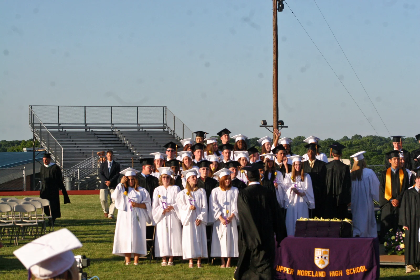 The first order of business was to have a chorus member perform the national anthem, while the graduates stood at attention. 