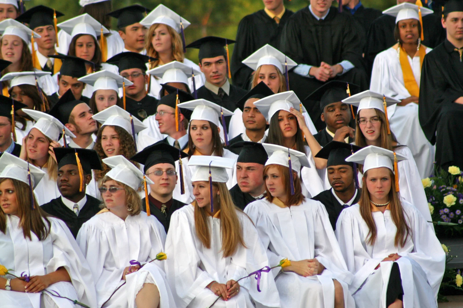 Here, a young woman gets up to sing a musical tribute to the graduates' success.
