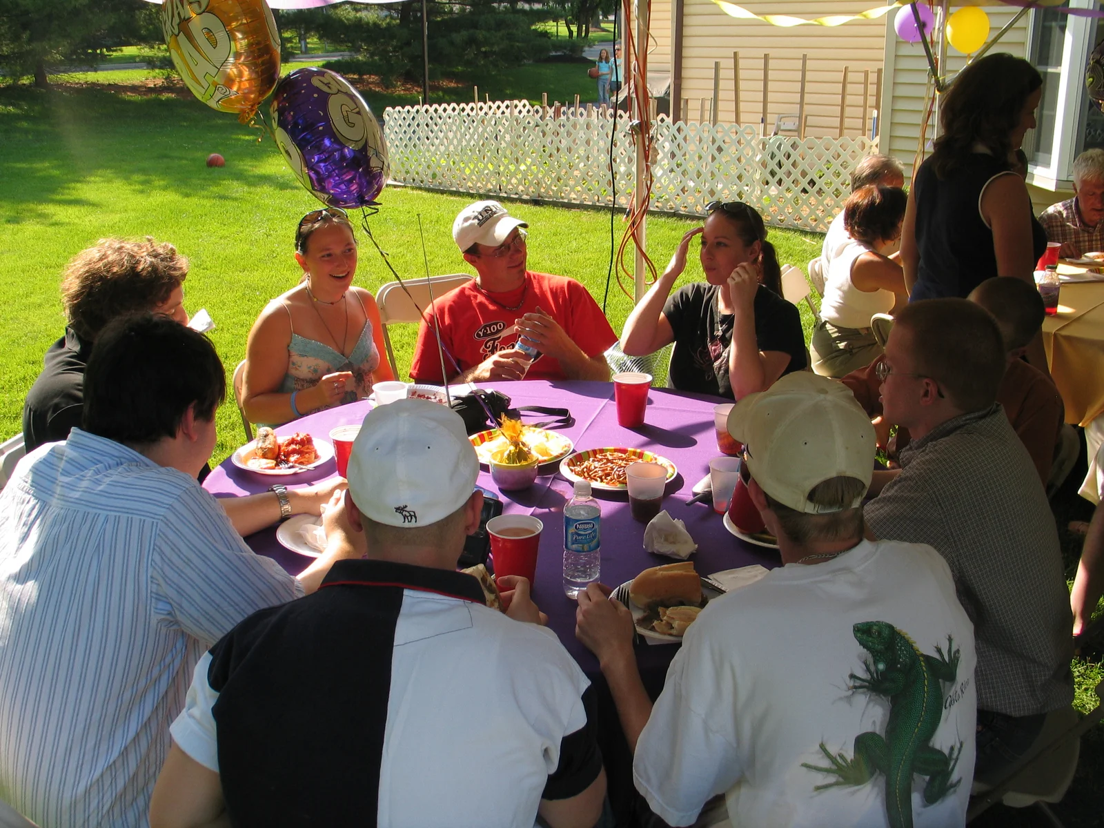 A group of friends of Steve and Christopher Sokolowski chat with each other during dinner.
