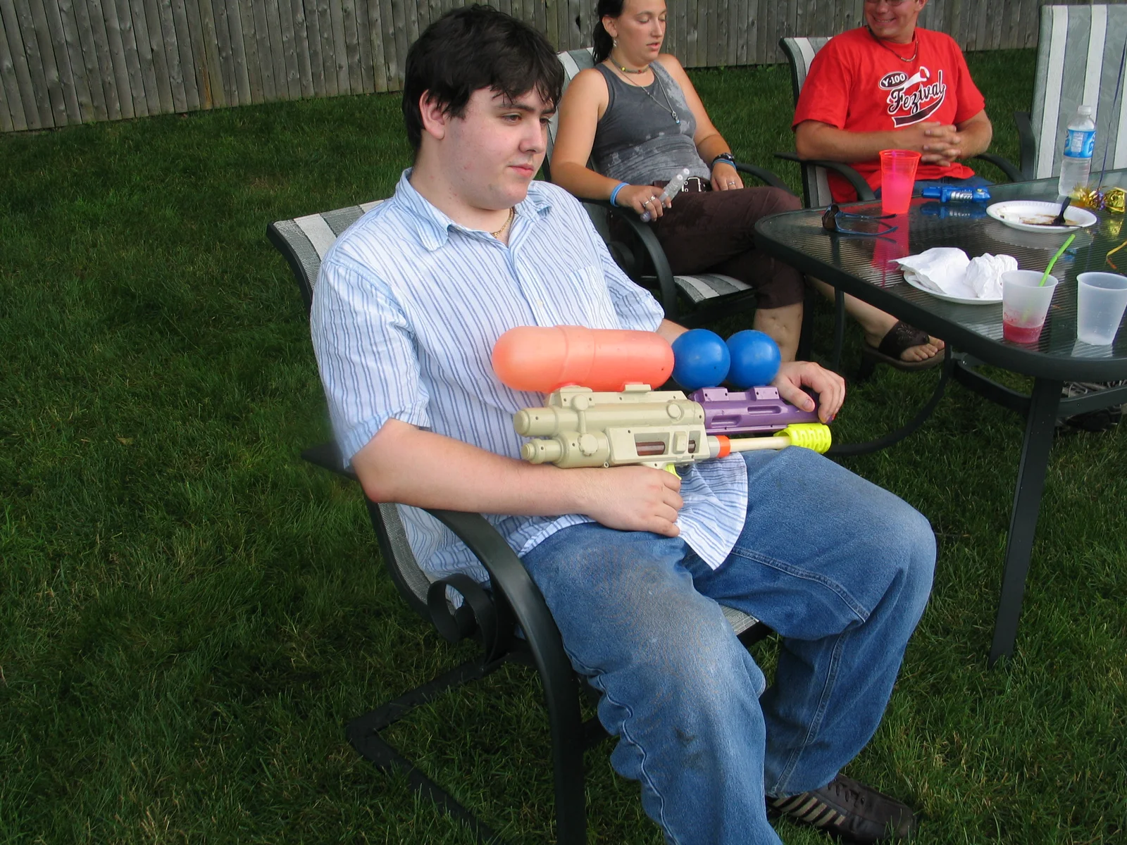 John Silvestri used a 10-year-old Super Soaker to make sure the little kids didn't approach the table.