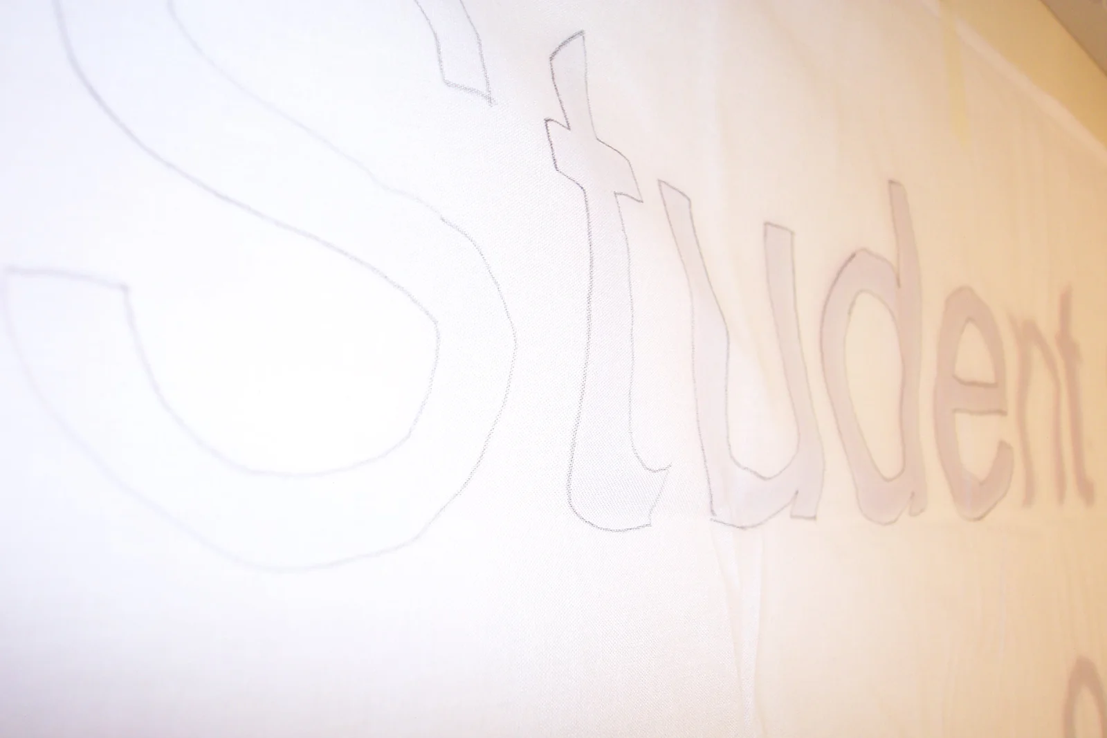 As you can see here, the next step involves tracing the design onto the sheet. 