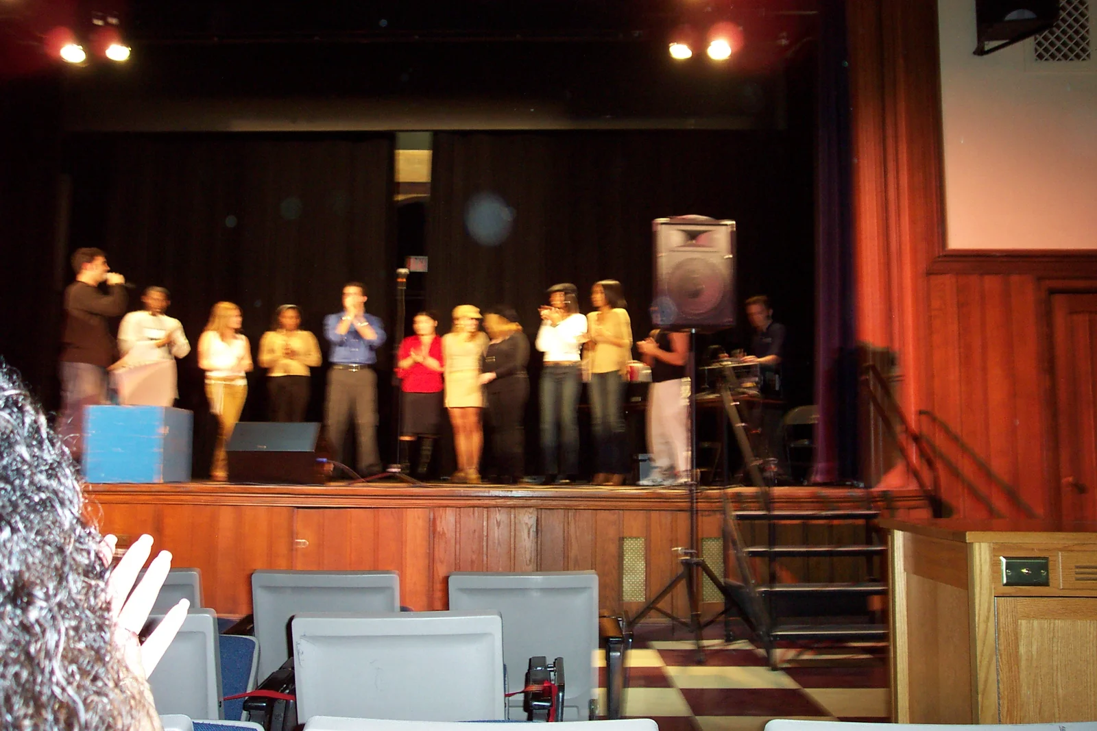 The contestants sing the national anthem, from a different angle.