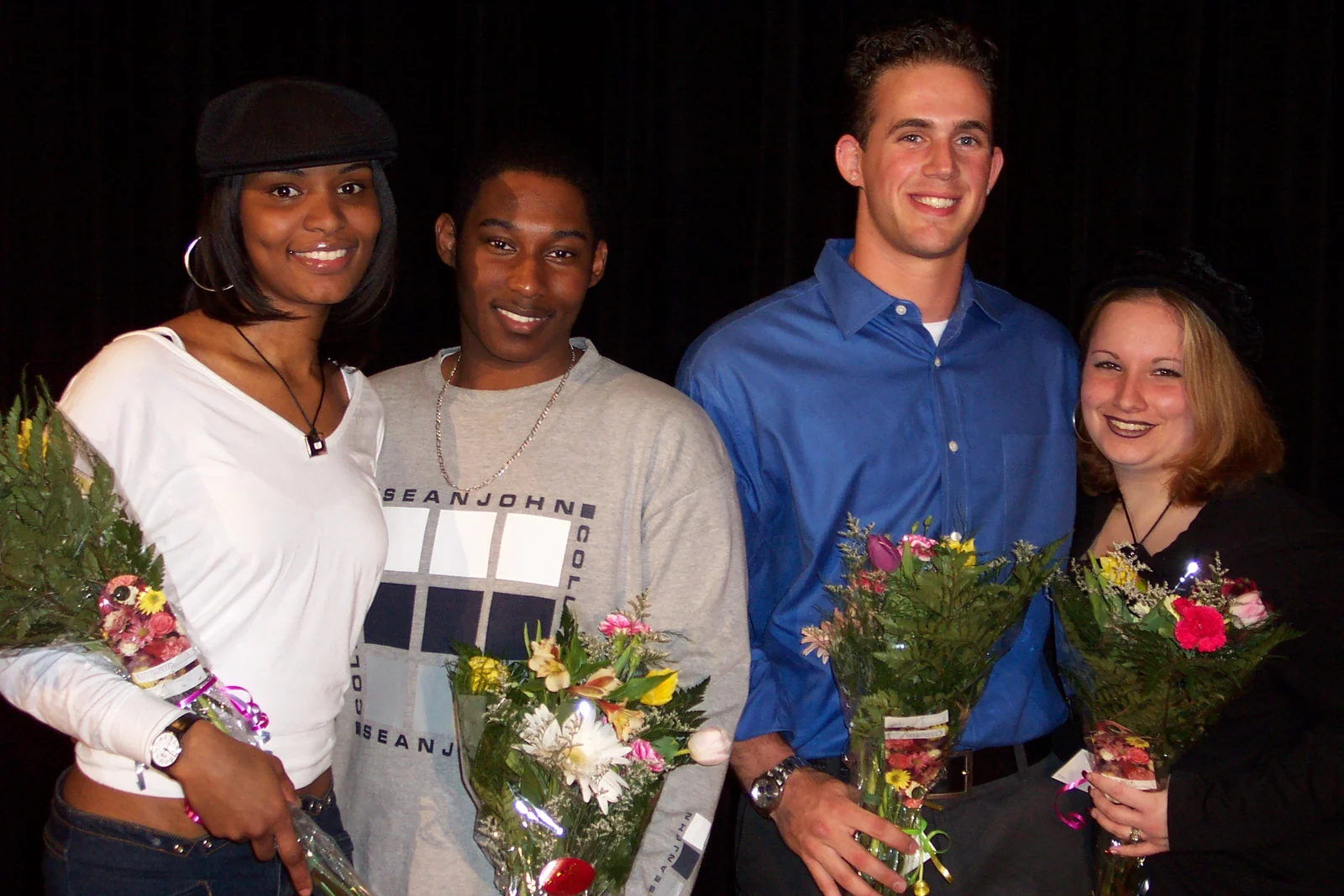 The two finalists and the two wildcard contestants pose for a victory shot. 
