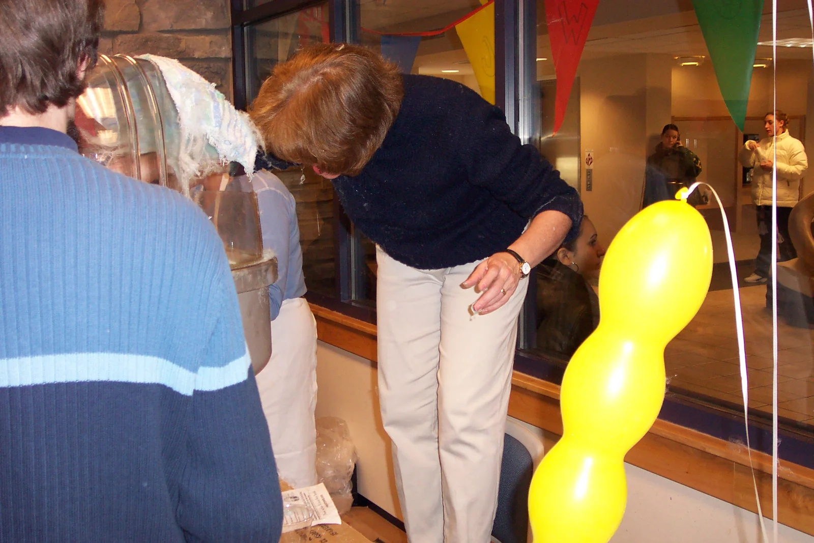 Marcia Delia, again scooping popcorn, this time from a different angle. 