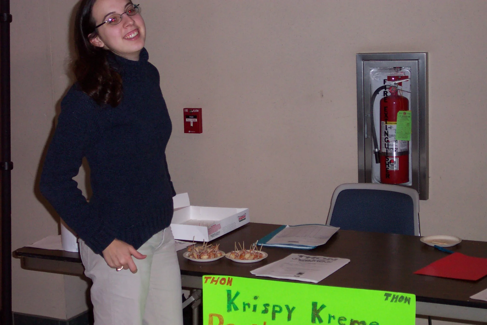Matilda Clipner stands outside the festivities, selling Krispy Kreme donuts to benefit THON.