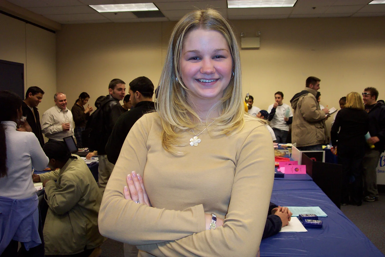 Kelly, SIFE Vice President, poses here after asking about a digital camera.