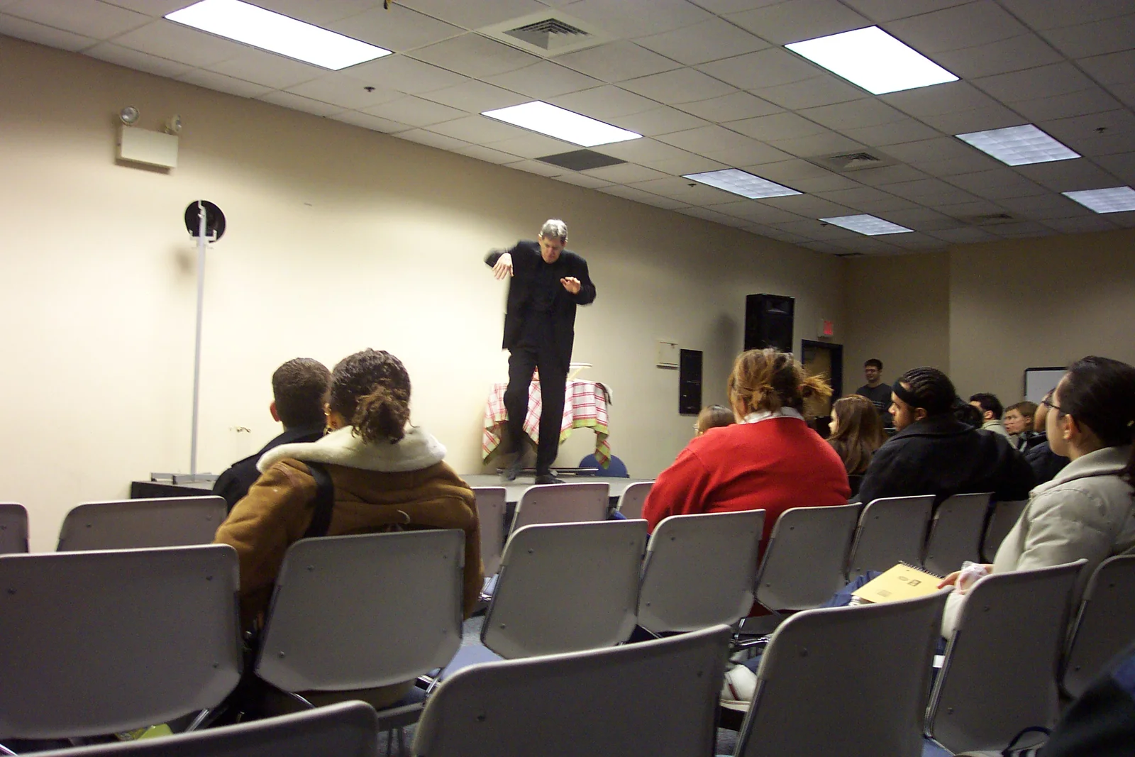 Another picture of Dan's unusual motions onstage. Here, he used props to create the effect he was somewhere else.