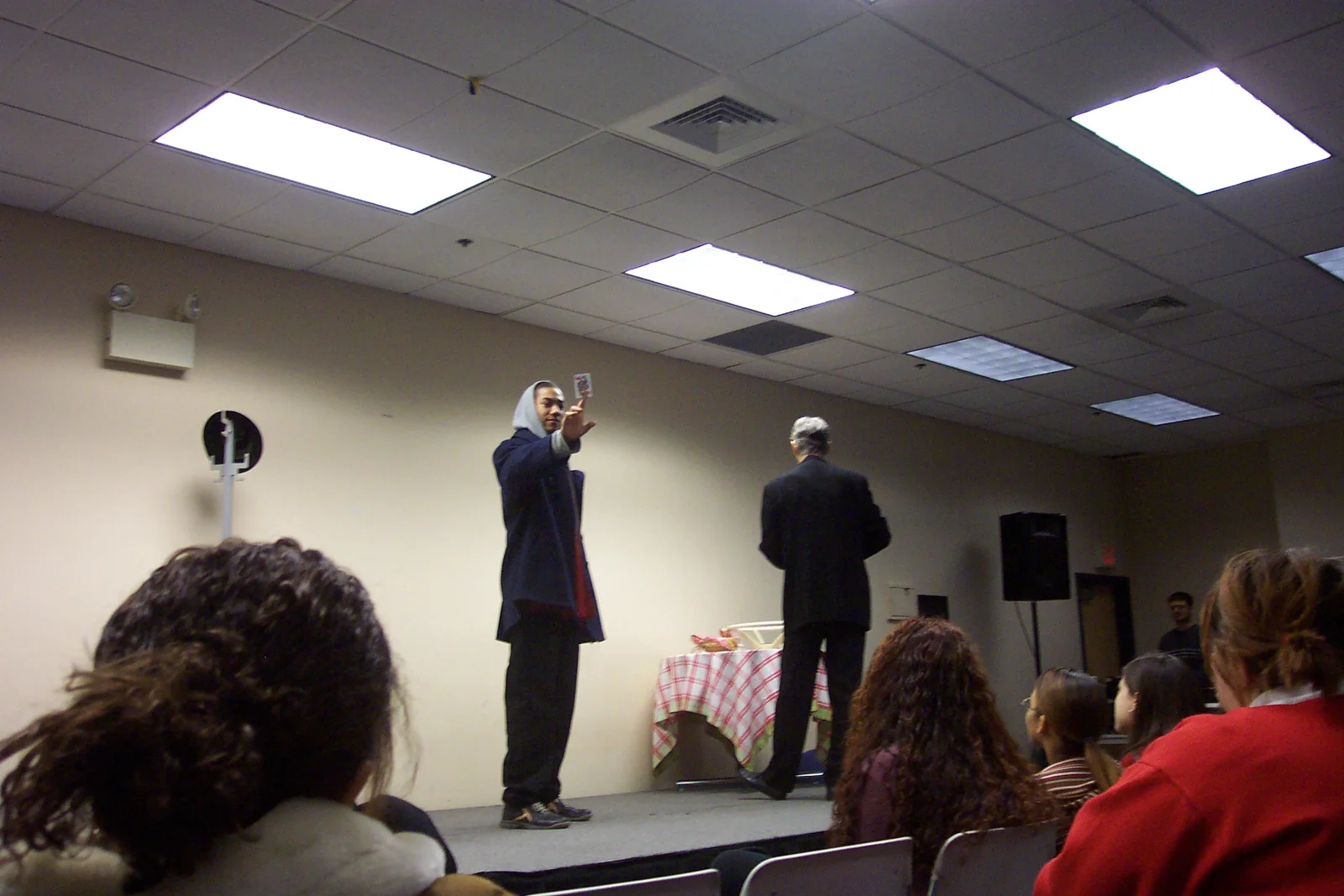 Another instance in which a volunteer helped Mr. Kamin, this time with a card trick.