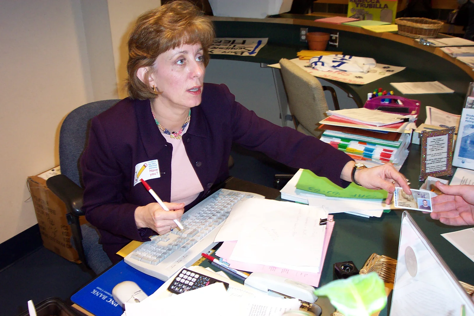 Marcia Delia checked student ID cards from everyone who voted.