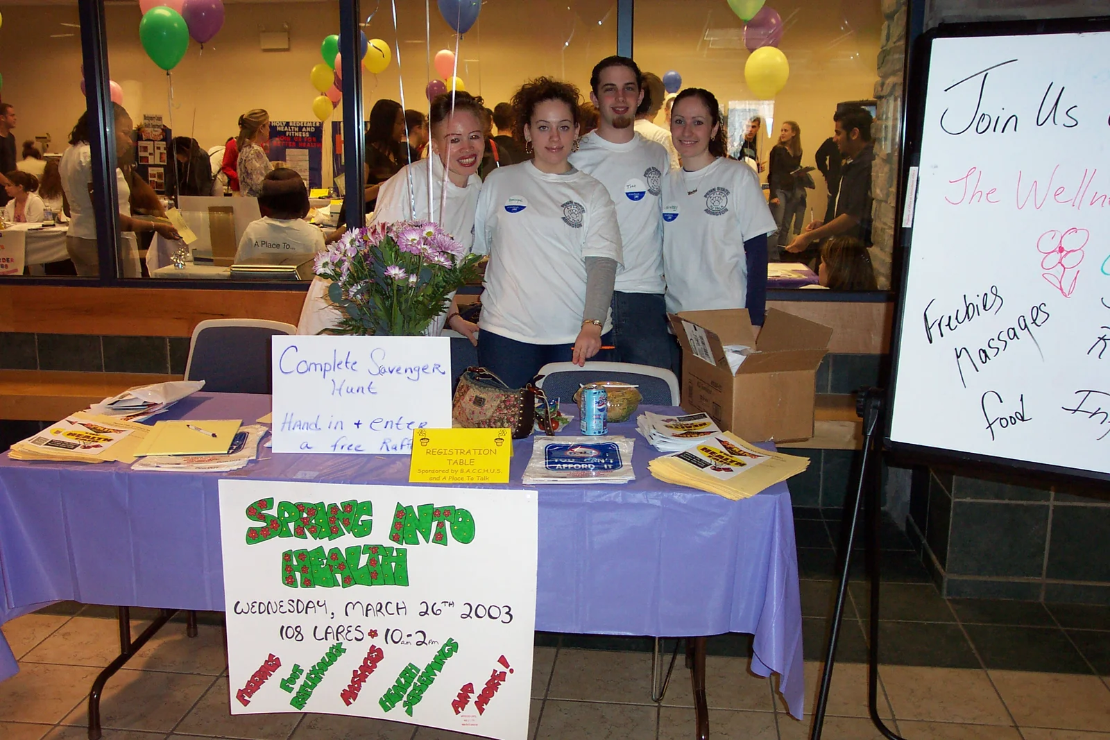 The members of A Place to Talk worked a registration table outside Room 108 Lares. 