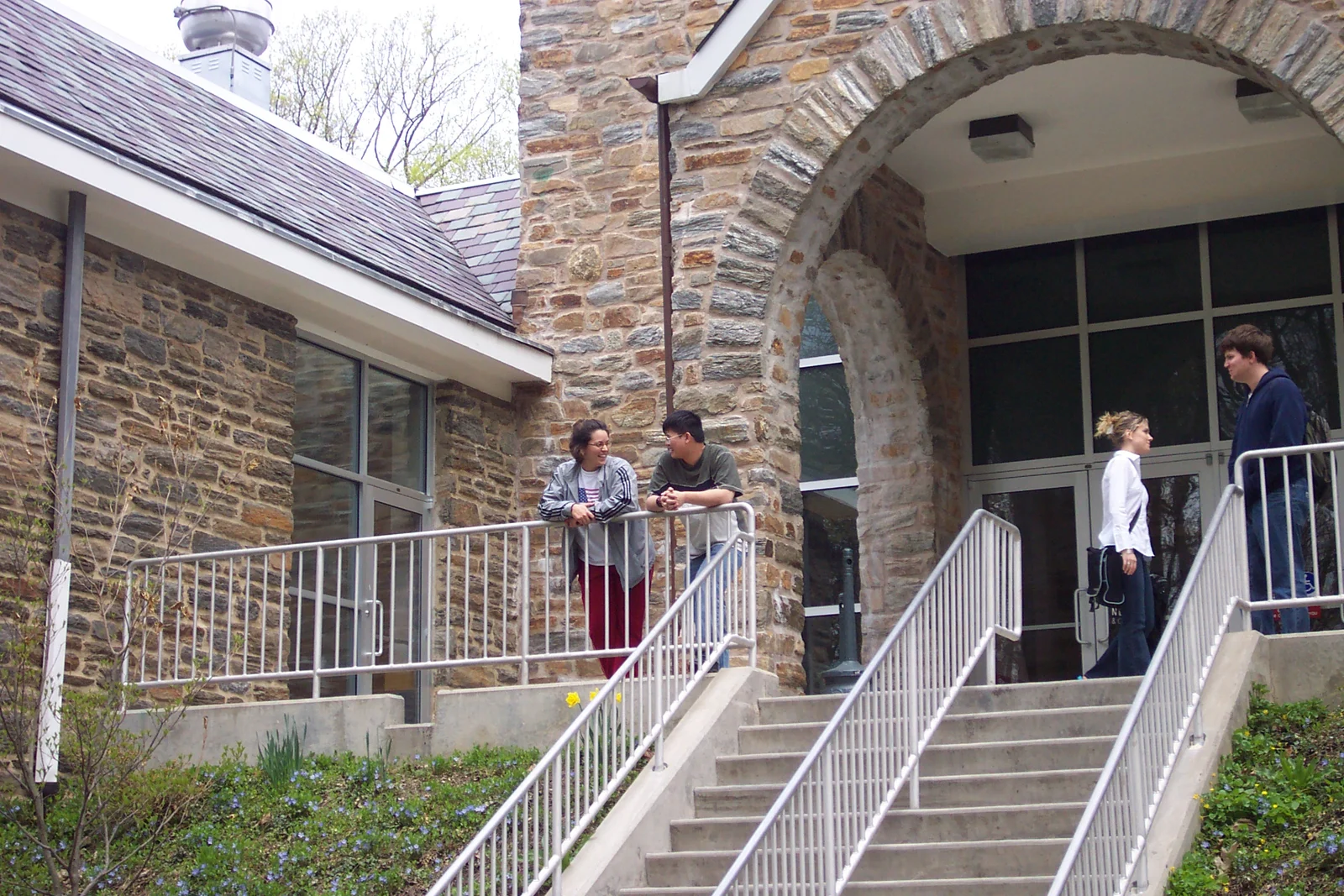 Rebecca Trubilla and Ty Tea chat while leaning against the rail outside the Lares building. 