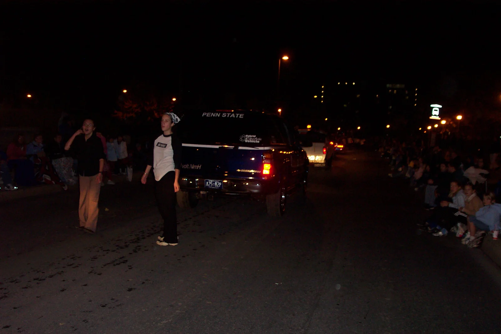 As the parade went on, some dancers became tired and had to rest by walking behind the car.
