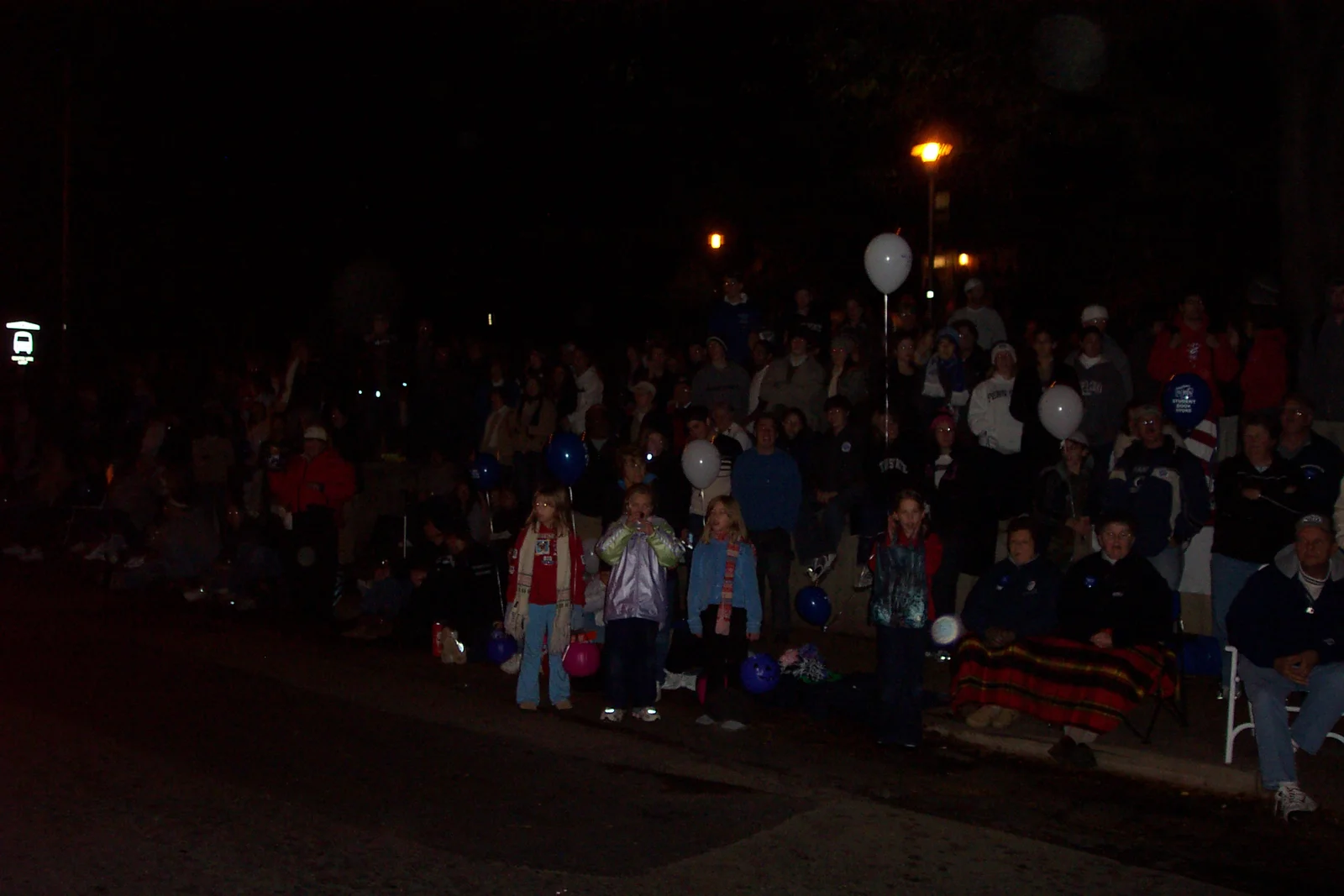 In front of Atherton Hall, people stood six or seven deep. 