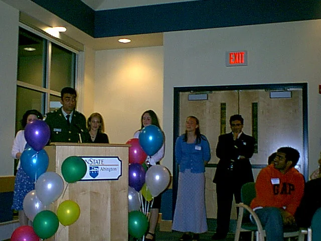 Several SGA members give a parting gift to their President.  From left to right:  Regina Fetterolf, Jayneel Patel, Amy Frizzell, Ashley Martin, Bridget Daly, and Ninad Pendharkar. 