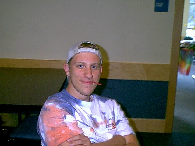 "Dirty" Dane Zdunowski wears a Spring Fling tie-dye T-Shirt and waits outside the banquet room before the event starts. 