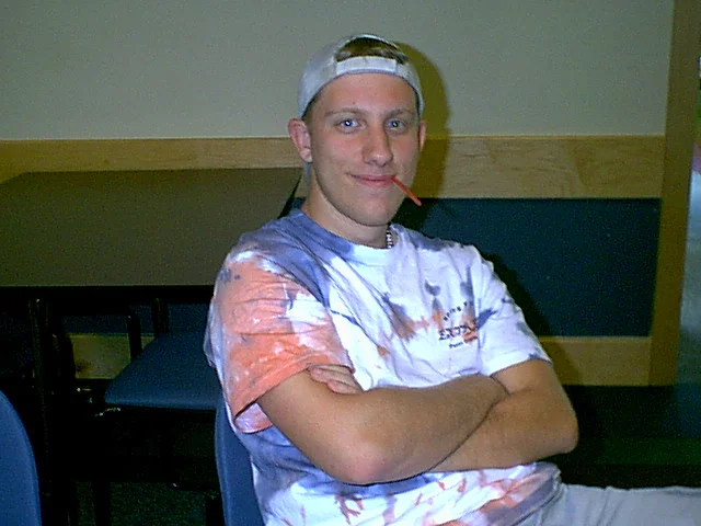 Dane's t-shirt was a sharp contrast from the suits and ties the other men attending the banquet wore. 