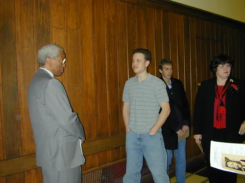 An engineering student speaks with Dr. Bluford.
