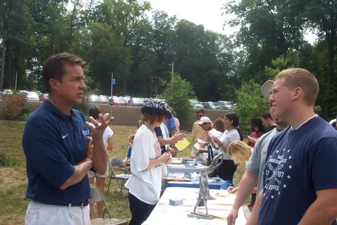 Physical Education faculty member Bob Barton introduces himself to new students interested in athletics. 
