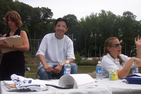 Calvin Tan represents an organization in the club involvement fair. 