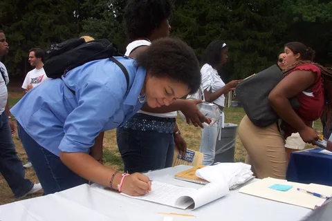 Danielle Taylor signs up for a club. 