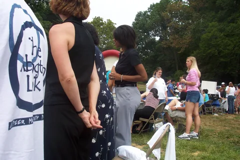 Stephanie Gillis, Latanya Moore, and a peer mentor talk to freshmen who would like to request a mentor. 