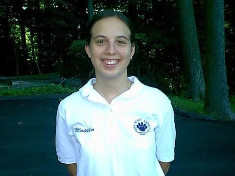 Matilda Clipner, who was to graduate the next year, posed again for the SURVIVOR-style slideshow that was produced for the July 19 orientation. 