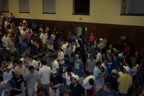 The parents and students leaving the building after orientation concluded.