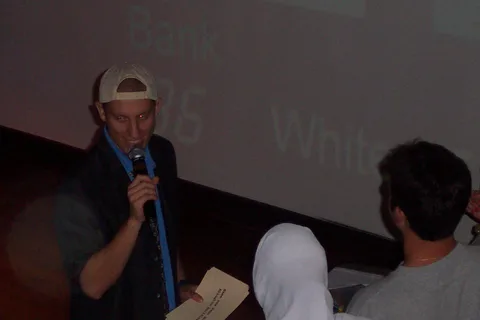 Dane walks up to one of the contestants, asking them to answer a question.